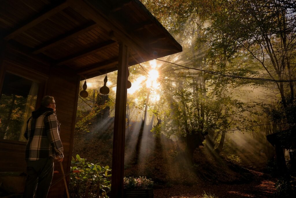 A person njoying quiet morning light, reflecting on his intentions and goals for the day.